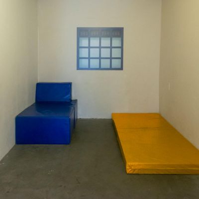 A serene view of an empty mat in a quiet room.